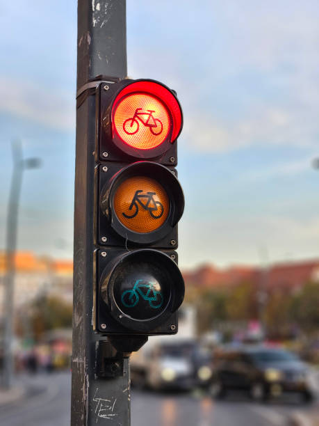 istock Red bicycle traffic light signage with black pole in Europe 2180702318