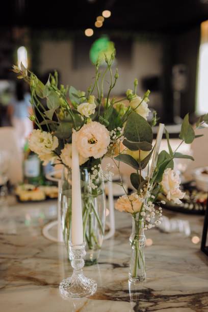 istock Elegant floral arrangement on marble table 2180704231
