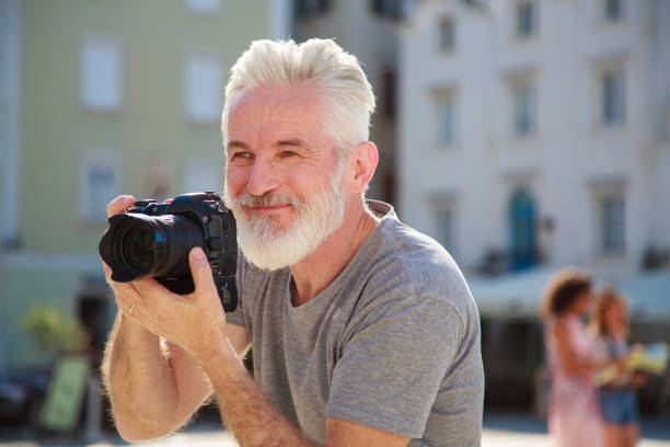 istock Senior photographer arranging his models 2180704470