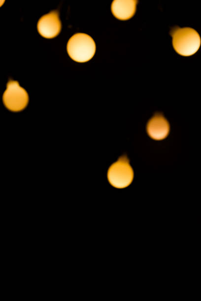 bokeh lights in the dark as a background. Light background.