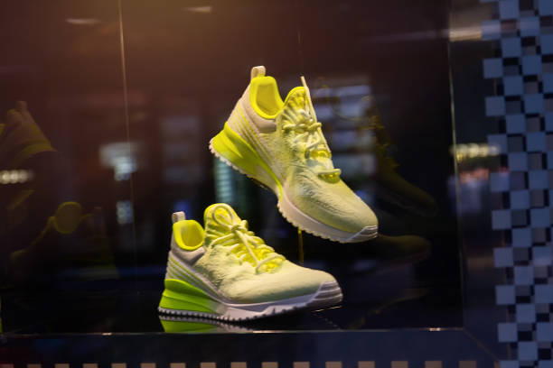 Trendy modern sneakers on display in the store window. Fashion