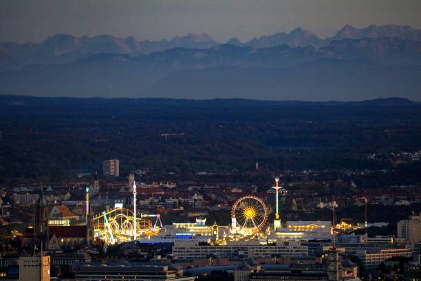 Distant nightview of the Beer Fest in Munich with the Alps mountains in the background