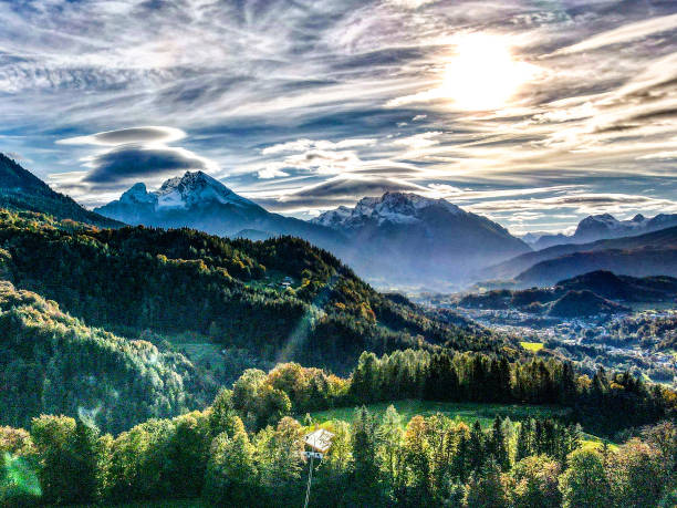 Berchtesgaden and Watzmann with hazy clouds and low sun on an late summer evening