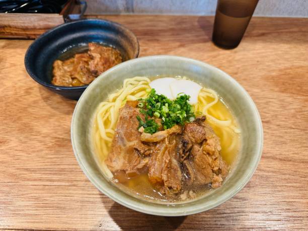 istock Ramen bowl with tender meat and green onions. 2180708067