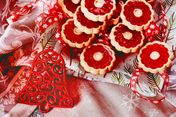 Christmas atmospheric mood. Thumbprint breakfast cookies with raspberry jam. Homemade freshly baked shortbread cookies, Happy New Year