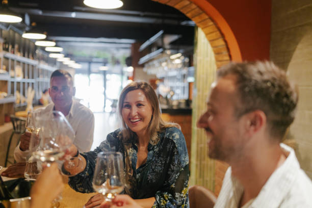 istock Friends tasting wine in a winery 2180711189
