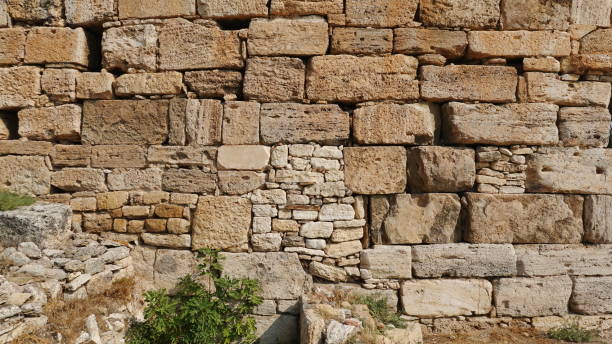 istock Sunlit Ancient Stone Wall Wide Angle Natural Colors 2180712417