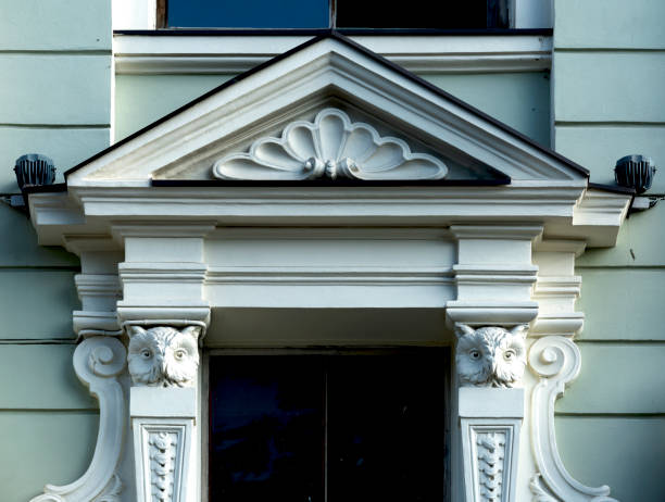 istock a pair of buho busts surround the window 2180712418