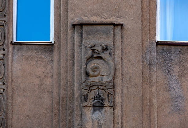 istock snail crawling around the brown building 2180712736