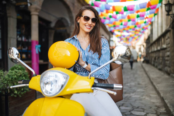 istock Female using moped to move around town. 2180714056