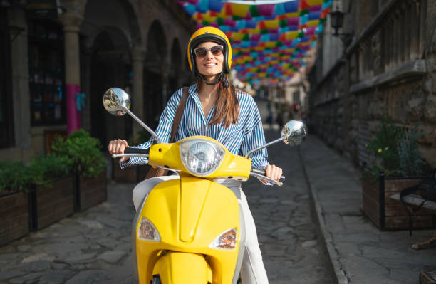 istock Female using moped to move around town. 2180714081