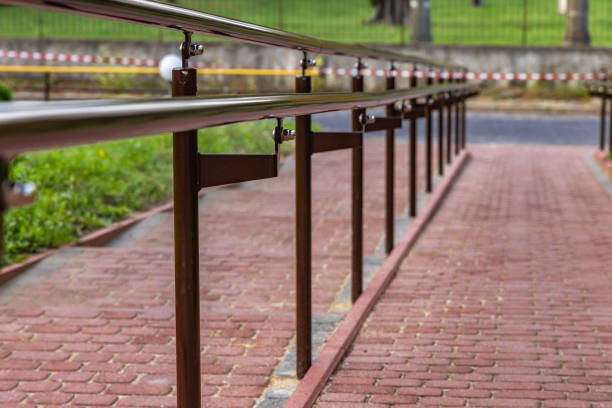 Ramp for wheelchair users, protective handrails on the ramp for people on crutches