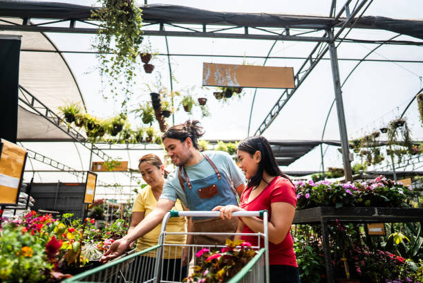 Salesman helping customers at a garden center