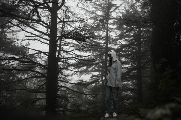 Woman in middle of the pine forest
