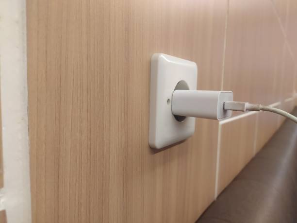 istock The cellphone charger is being plugged into electricity to charge 2180723821