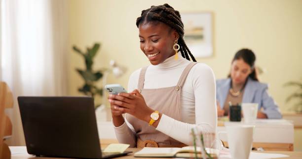istock Office, laptop and woman with cellphone with connection, networking or reading email from client. Career, business or consultant with smartphone with mobile app for text message, check date or online 2180723955
