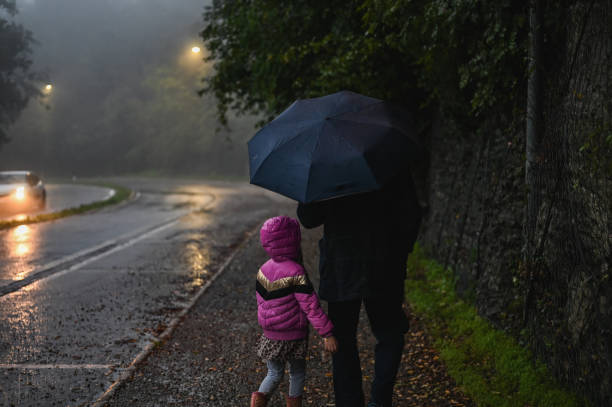 istock Father with daughter at rainy day. 2180725391