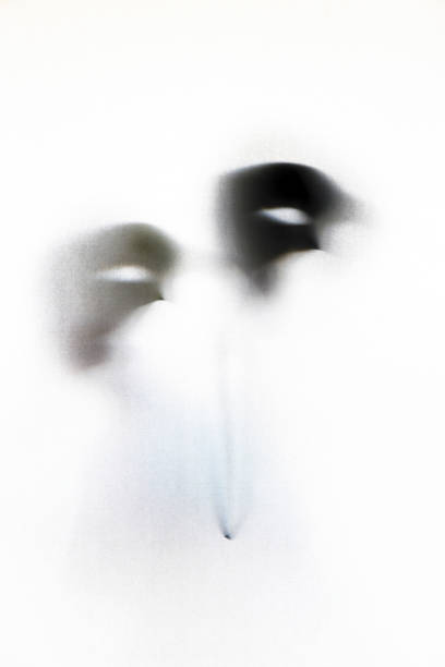 Abstract Phantom of the Opera mask behind the curtain.