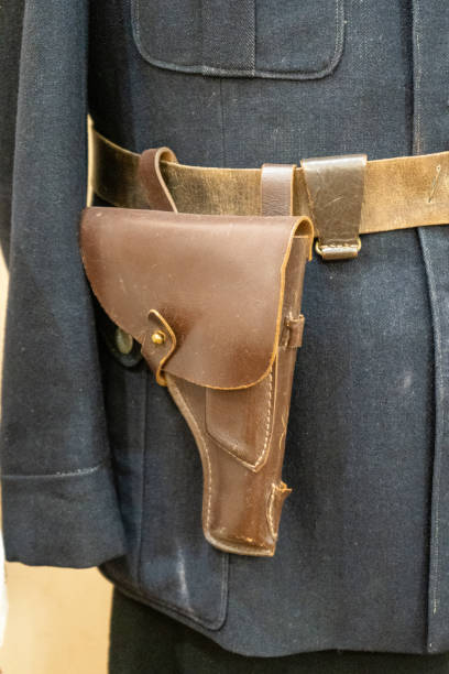 istock Leather pistol holster on the belt. 2180729508