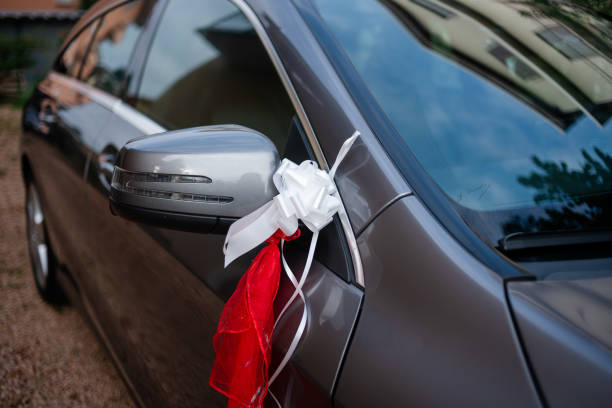istock Car with a white bow on the mirror for weddings. 2180737278