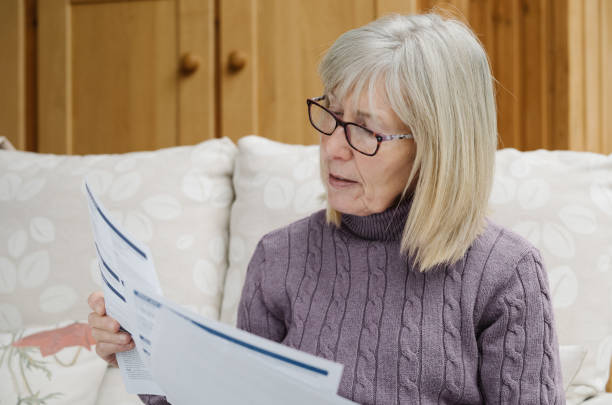 istock Worried senior woman just received a bill 2180737727