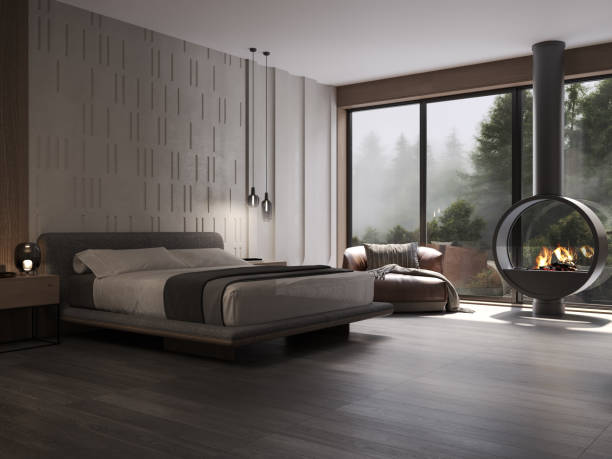 Modern matte natural stone tiles bedroom interior with walk in wardrobe and shower. Master bedroom interior. Modern king size bed with black gloss side tables. Black carpet and ceiling with down lighters. Light stone marble flooring. 3d rendering.
