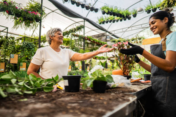 istock Customer choosing flower pot at a garden center 2180743370