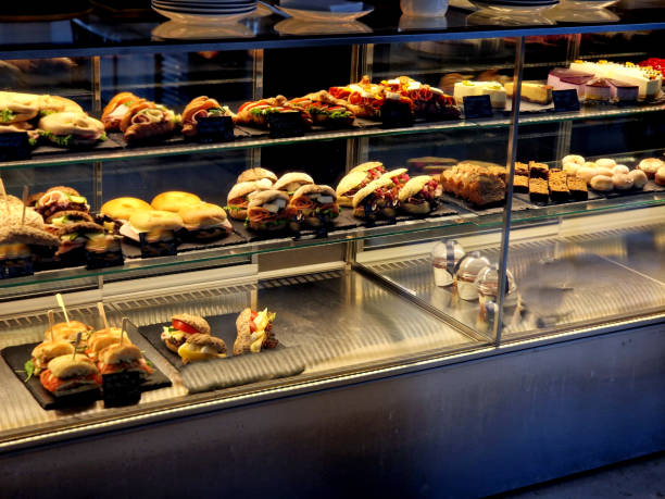 istock display case for a display of pastries and delicious baguettes, donuts, cakes and sweeter pastries made from yeast dough. glass refrigerated counter 2180744584