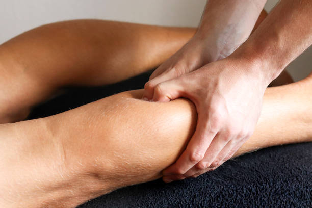 istock Masseur does legs massage in spa center 2180746665