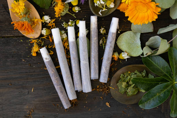 istock Herbal cigarettes with flowers and plants with medicinal properties 2180746770