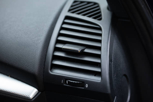 istock Car interior air ventilation or vent with grill and adjustment level. Black plastic interior, close up shot, no people 2180746791