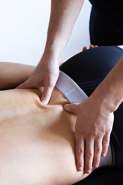 istock Masseur does back massage in spa center. 2180746851