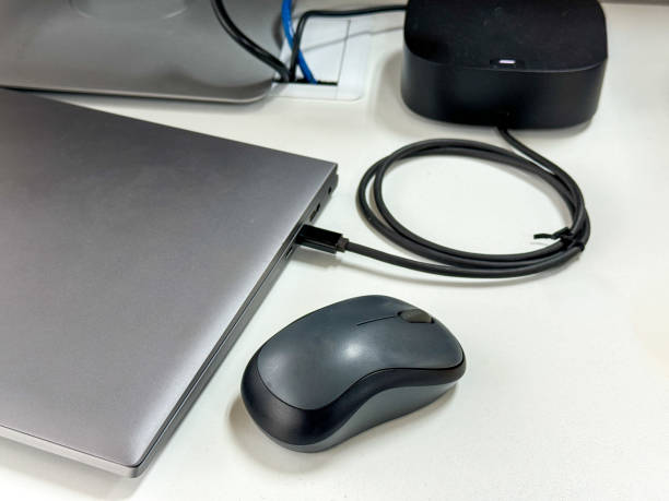 istock laptop and wireless mouse on office desk 2180749917