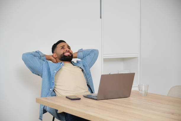 istock Young entrepreneur relaxing taking break at workplace 2180750391