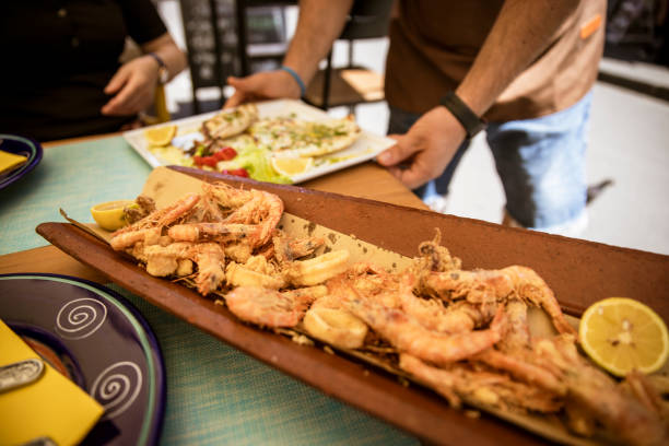 Seafood serving in Mediterranean street restaurant