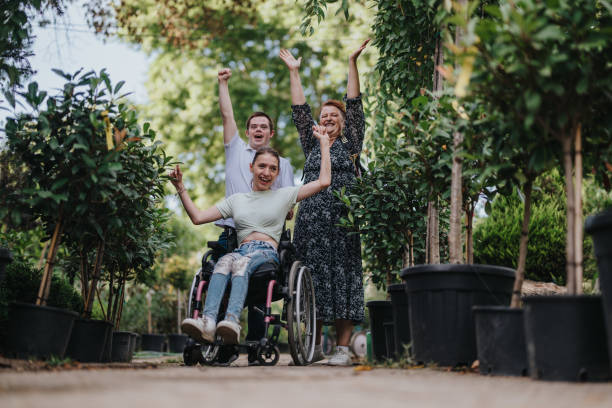 istock Group of friends celebrating joyfully outdoors among greenery 2180754909