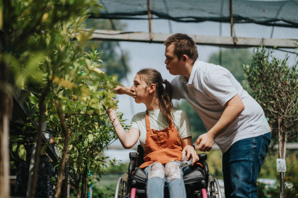 istock Compassionate friendship between two young people in a vibrant garden 2180755264