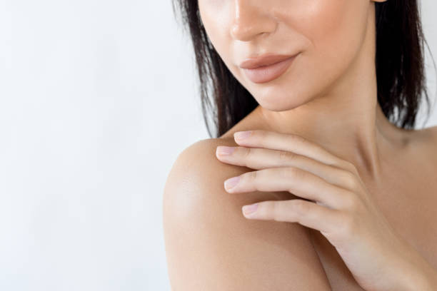 istock Woman posing with her hand on her shoulder 2180760007