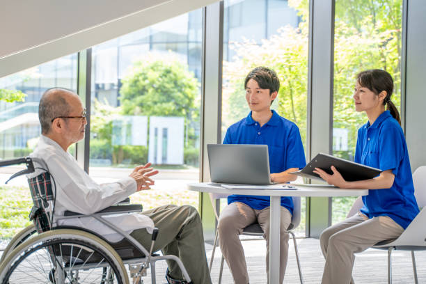 istock Nursing staff and senior man counseling 2180760380