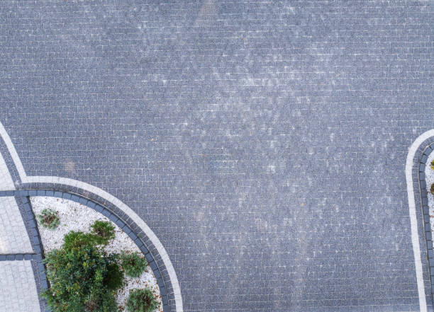 istock Aerial View of a Modern Paved Path Lined With Minimalistic Landscaping and Stones 2180761650