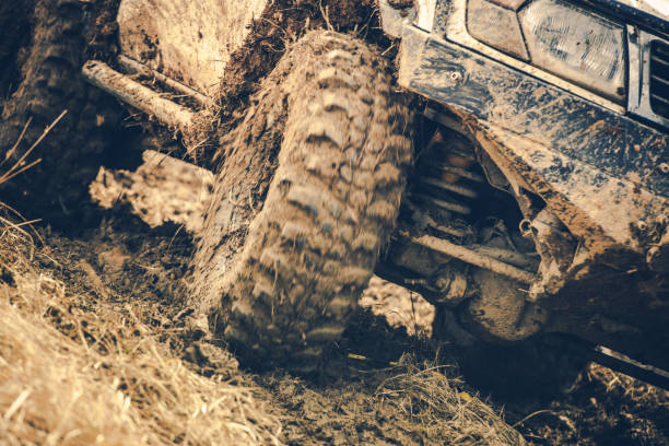 istock Mud-covered Vehicle Navigating Through Tough Terrain in an Off-Road Adventure Setting 2180761675