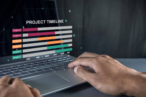 istock Man working on laptop to check the project timeline, milestones and planning progress on virtual screen 2180762475