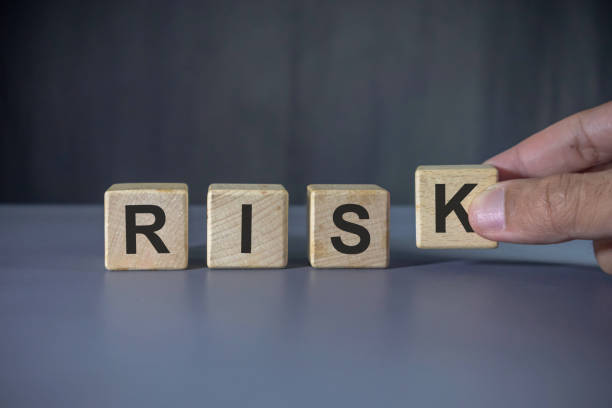 istock Hand holding wooden block with risk word. Risk management concept. 2180762759