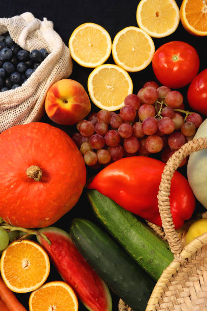 istock Straw Bag And Healthy Produce On Dark Background 2180768415
