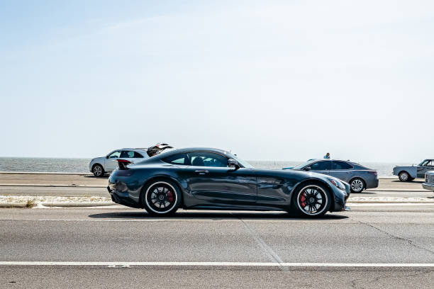 Mercedes-AMG GT Coupe driving on the street of Monte Carlo in the Grand Hotel Hairpin of the Monaco race track. Panning photo with motion blur.