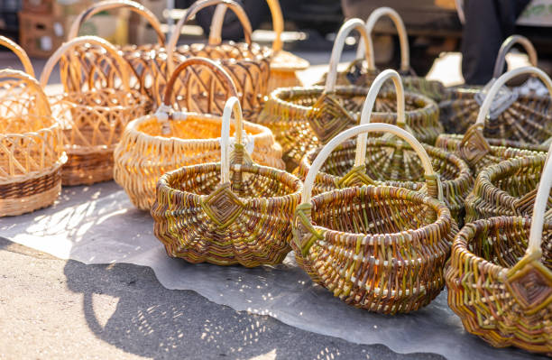 istock A collection of traditional handcrafted wicker baskets on display under sunlight at an outdoor market, showcasing sustainable and eco-friendly craftsmanship. 2180775658