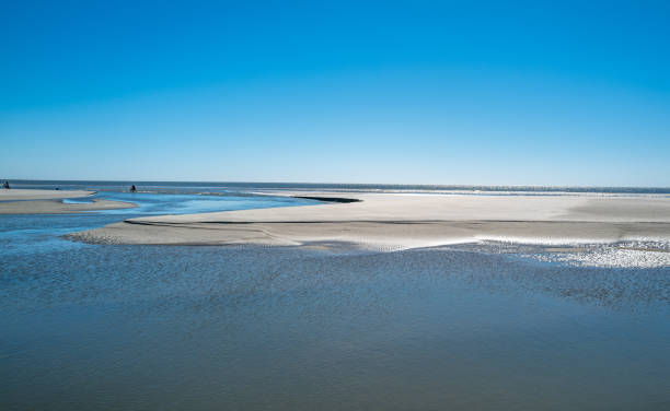Various views of the beach on Kiawah Island, South Carolina in the early fall.  The beach is approximately 10 miles long with hard packed sand making it possible to ride bikes for the entire length.  This pristine beach is enjoyed by tourists and residents of the Island for its' tranquility and natural beauty.
