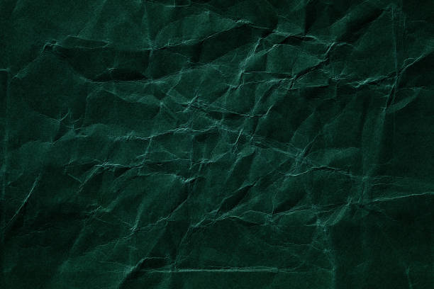 istock Dark green crumpled paper texture 2180778427