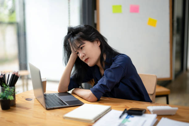 istock Employees sit and work stressed, work hard, feel bored, think too much from work, and make mistakes. 2180784406