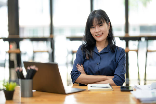 istock Young businesswoman thinking while working at the table in the office.  Analyze and plan work 2180785304